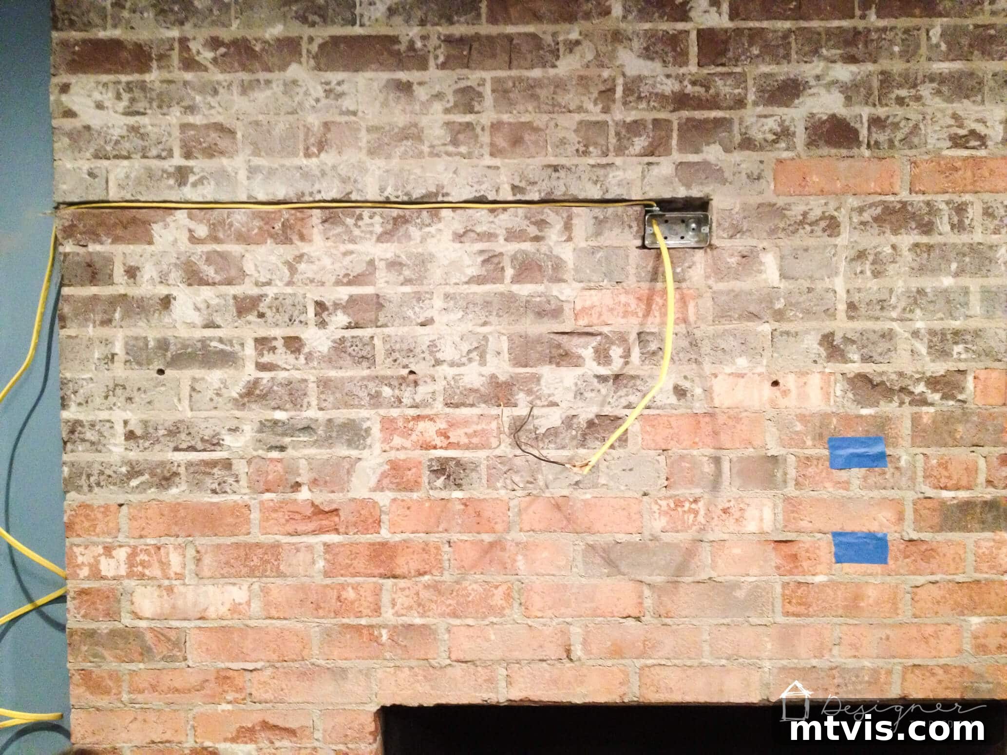 Stylish Concrete Fireplace Build for Under 100 5 A channel carved into the brick mortar joints of a fireplace to accommodate hidden electrical wiring, preparing for a contemporary, cord-free setup.