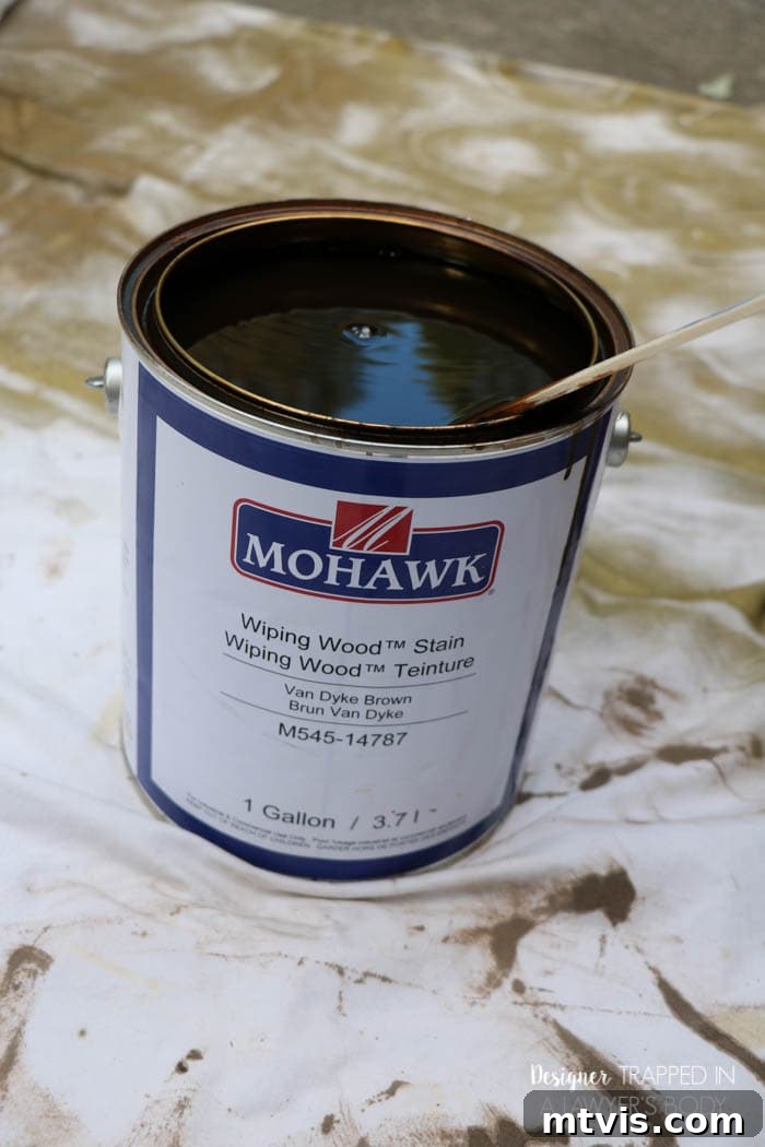 Effortless Wood Chair Refinishing 10 Applying Mohawk Wiping Wood Stain with a foam brush to an antique chair, demonstrating the non-sanding refinishing process.