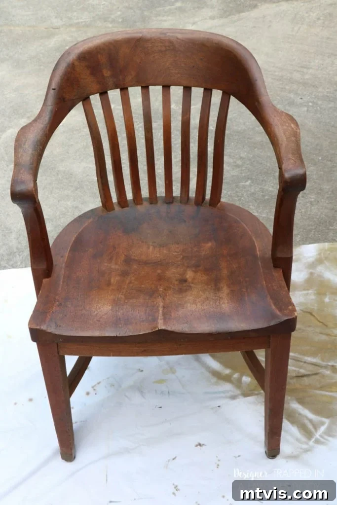 Effortless Wood Chair Refinishing 14 BEFORE: Close-up of antique wood chair seat with significant staining.
