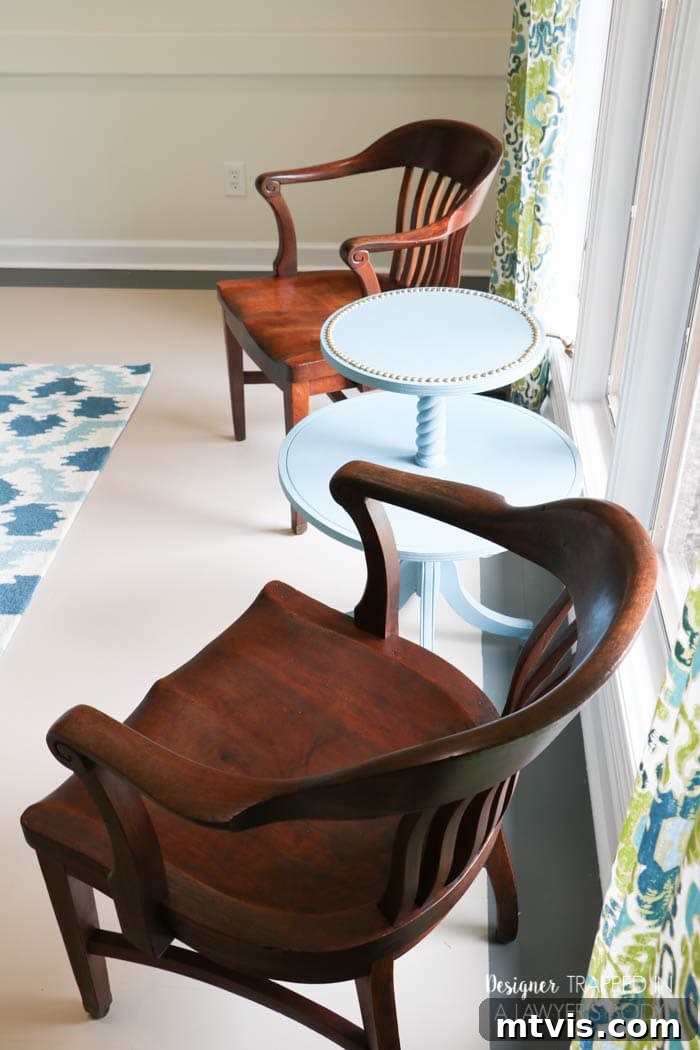 Effortless Wood Chair Refinishing 22 Beautifully refinished antique wood chairs positioned in a dining room, adding elegance to the space.
