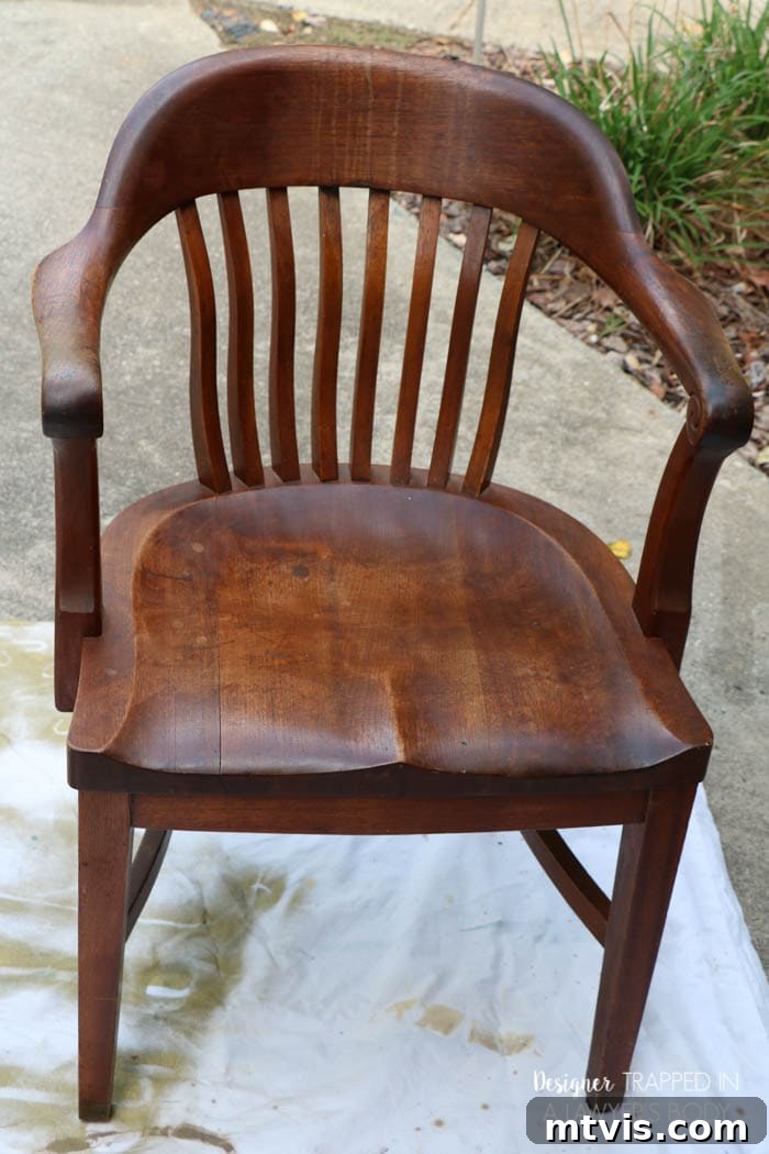 Effortless Wood Chair Refinishing 5 Second antique wood chair before refinishing, highlighting noticeable drip marks on the backrest. Discover how to camouflage these flaws.