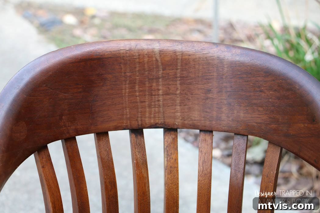 Effortless Wood Chair Refinishing 6 Close-up of the second wood chair's back support with prominent drip marks, prior to its amazing transformation.