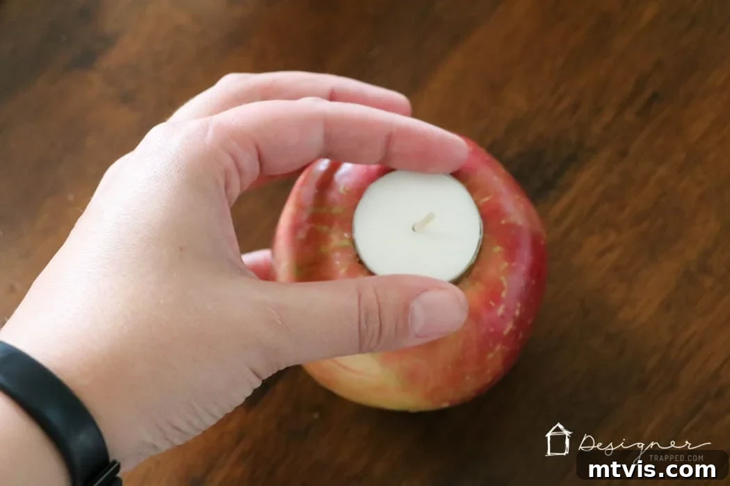 Crafting Homemade Apple Candles 5 Fresh apples transformed into elegant tea light candle holders arranged as a beautiful table centerpiece